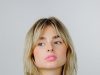 Layered for Life: Mastering the Art of Winter Dressing with Style and Substance a woman with blonde hair wearing a white blouse