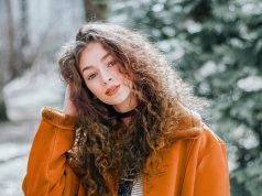 The Vision of Alexander McQueen: Darkness, Drama, and Design woman, female, girl, portrait, model, young woman, curly hair, fashion, style, outfit, beauty shot, female model, modeling, pose, posing