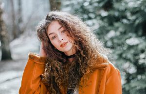 The Vision of Alexander McQueen: Darkness, Drama, and Design woman, female, girl, portrait, model, young woman, curly hair, fashion, style, outfit, beauty shot, female model, modeling, pose, posing