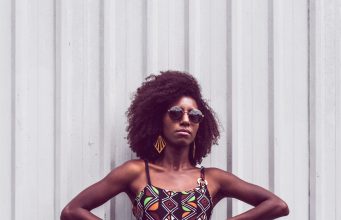 Reinventing Your Wardrobe: How to Make Old Clothes Look New Again woman standing with hands on her waist