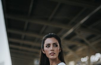 From Desk to Dinner: Mastering Effortless Day-to-Night Style Transitions woman standing in front of train