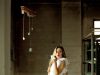 Hot Weather Workwear: Dressing for Comfort and Performance woman holding ceramic cup near table
