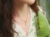The Power of Simplicity: How Neutral Pieces Quietly Define Bold, Beautiful Wardrobes a close up of a person wearing a necklace
