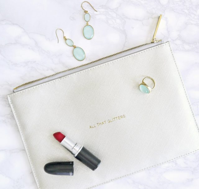red lipstick, white leather bag, and earrings