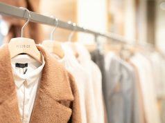 Creating Stylish Outfits From Few Pieces: Maximizing Your Wardrobe Potential brown coat hanged on white plastic hanger