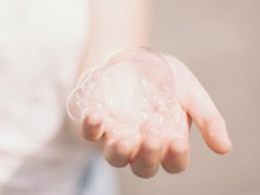 Beyond Glitter and Glam: The Cultural Power of Euphoria-Inspired Makeup person holding bubbles