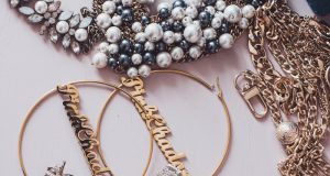 Minimalist vs. Maximalist Pieces: A Tale of Two Aesthetics gold and silver beaded necklace