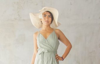 Reimagining Wardrobes: The Art of Turning Dresses Into Skirts woman in green spaghetti strap dress